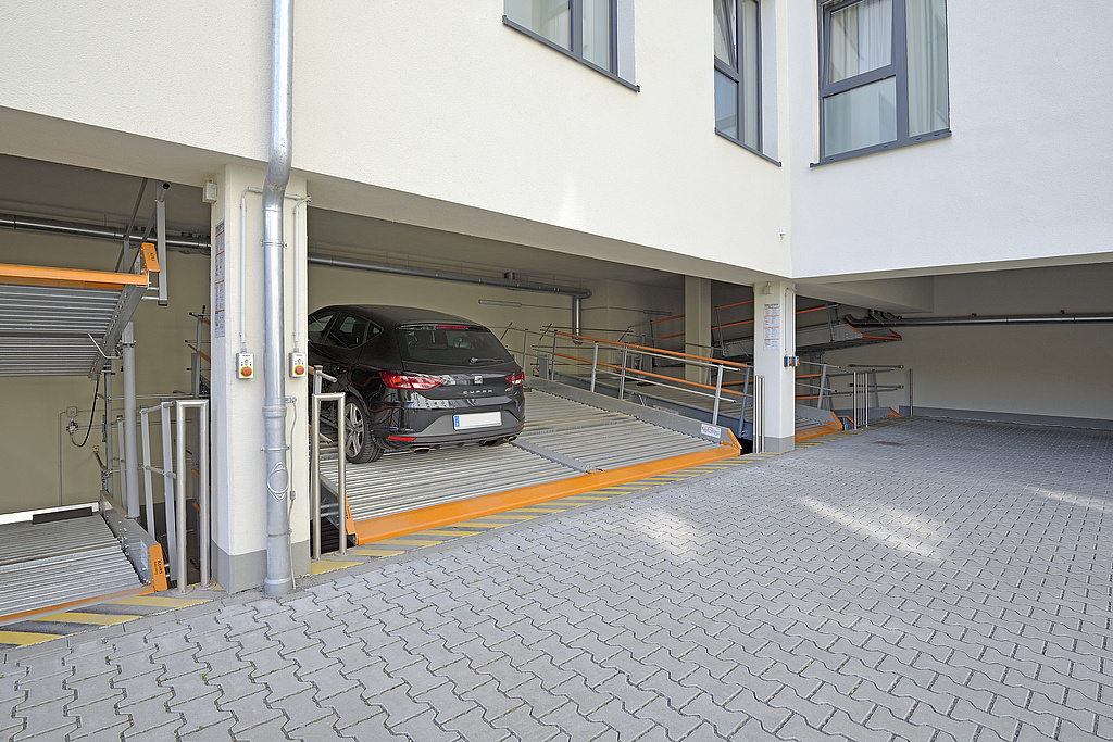 MultiBase 2042 parking systems with vehicle installed in the open part of the building
