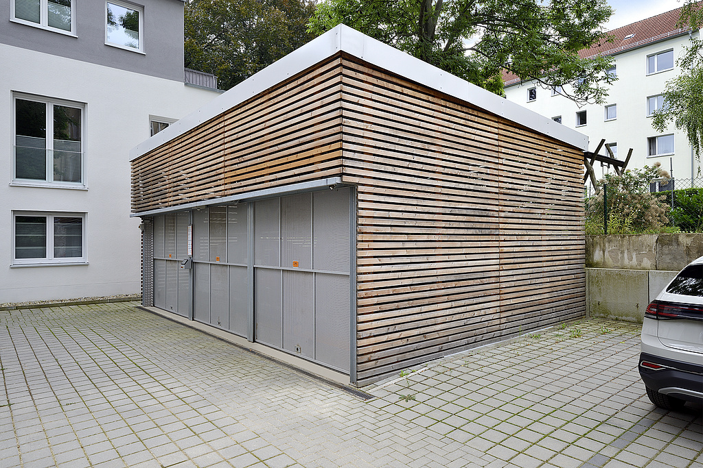 Garage exterior view with wooden facade
