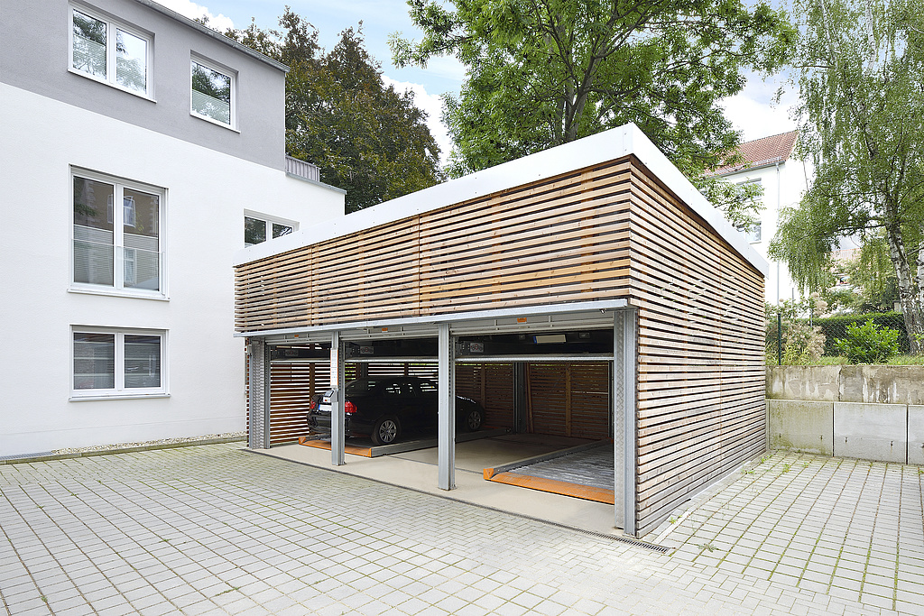 Garage with wooden facade and parking system