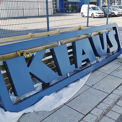 Illuminated advertising of the company logo before assembly